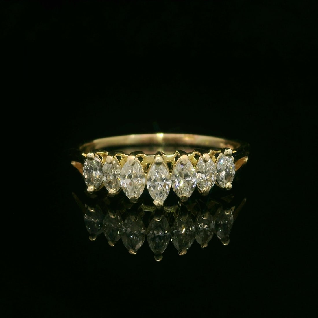 14k Yellow Gold Marquise Diamond Pyramid Band Ring 1.0ctw: 14k Yellow Gold Marquise Diamond Pyramid Band Ring 1.0ctw This stunning band ring features a unique pyramid design crafted in 14k yellow gold, showcasing seven exquisite marquise-cut diamonds. Each di