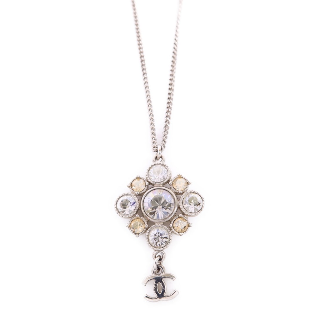 Silver Tone Necklace with CC Emblem by CHANEL: Silver Tone Necklace with CC Emblem by CHANEL This CHANEL CC necklace features a silver-tone metal construction, showcasing the iconic CC logo. The necklace does not include any stones and is crafted