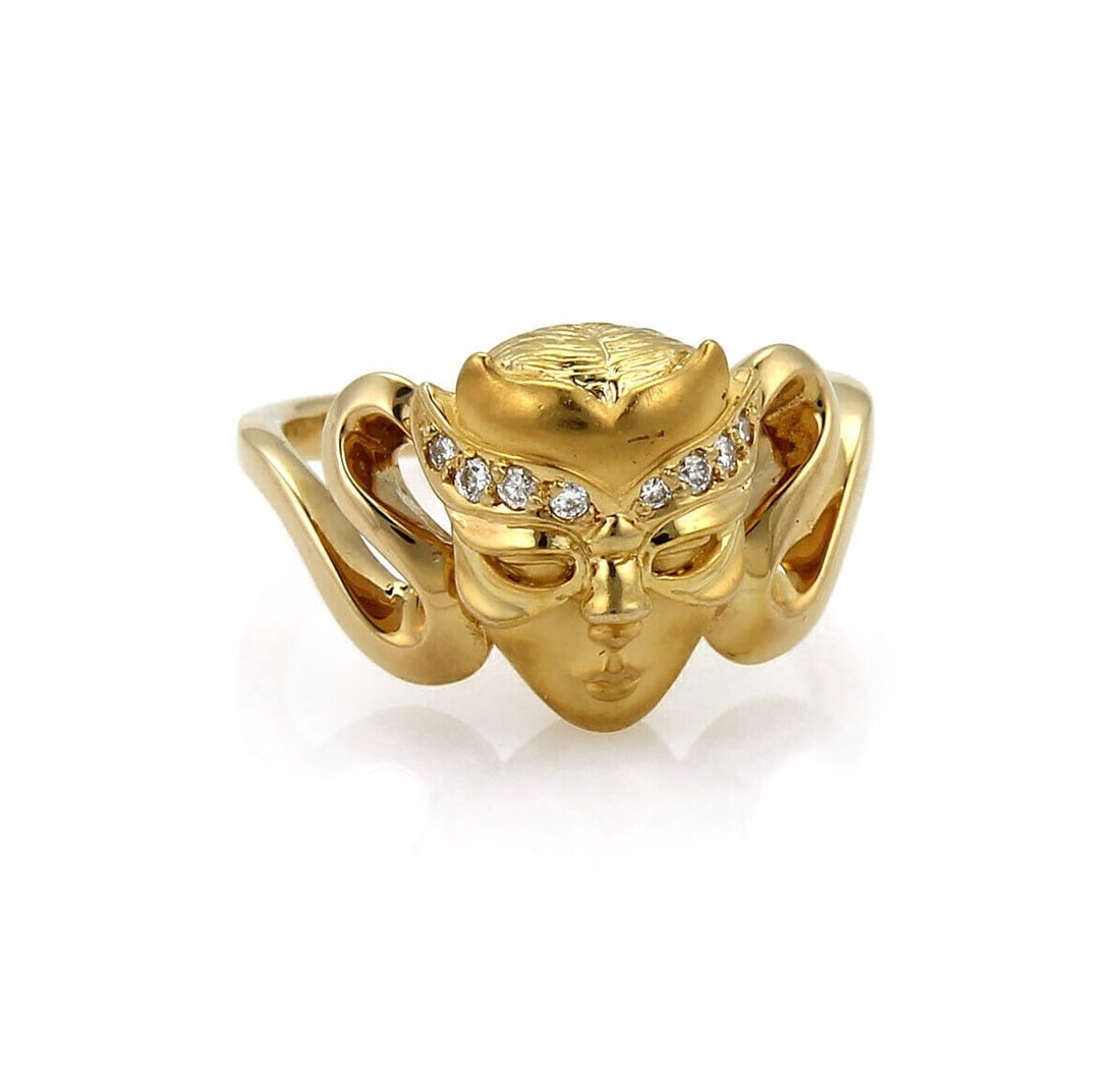 Masked Face Diamond Ring in 18k Yellow Gold by Carrera y Carrera Size 6: Masked Face Diamond Ring in 18k Yellow Gold by Carrera y Carrera Size 6 This Carrera y Carrera ring is crafted from 18k yellow gold and features a distinctive masked woman's face design. Accentuated b