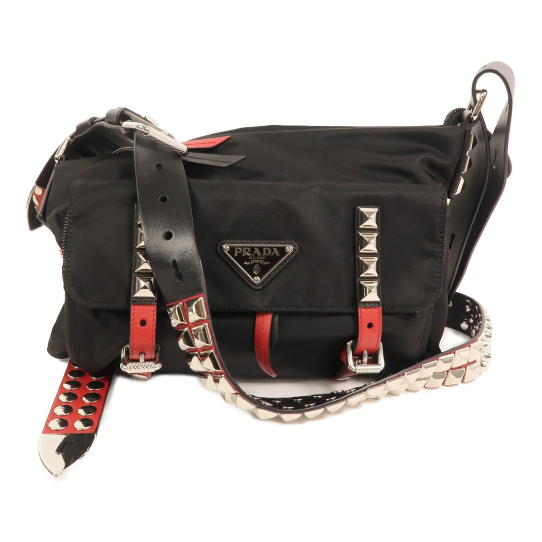 Prada Black Nylon 1BC098 Shoulder Bag with Silver Hardware: Prada Black Nylon 1BC098 Shoulder Bag with Silver Hardware This Prada shoulder bag features a sleek black nylon exterior and a silver-tone hardware finish. Designed with a regular size type, it offers