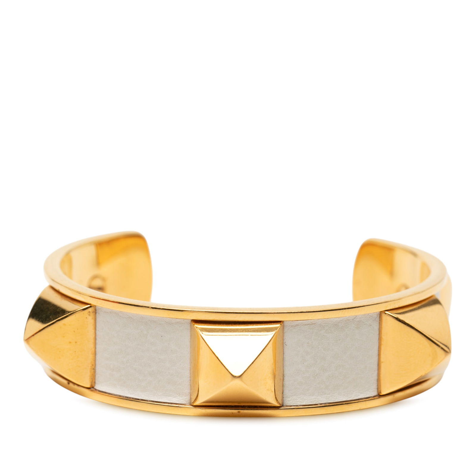 Hermes Medor Stud Leather and Gold Tone Metal Bracelet: Hermes Medor Stud Leather and Gold Tone Metal Bracelet This Hermes Medor Stud bracelet features a gold-tone metal and leather construction, showcasing the brand's distinctive stud embellishments. The
