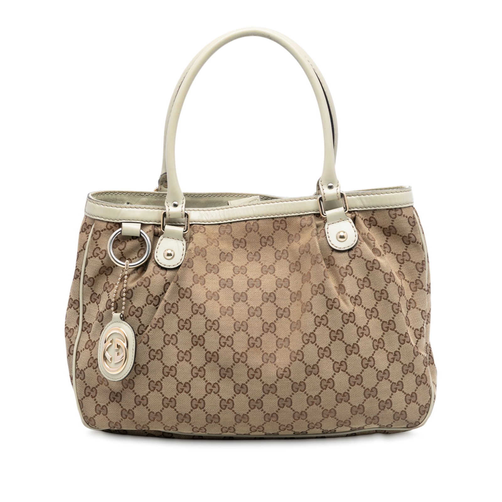 Gucci Sukey Brown Canvas Tote with Leather Trim and Magnetic Closure: Gucci Sukey Brown Canvas Tote with Leather Trim and Magnetic Closure This Gucci GG Canvas Sukey Tote features a brown canvas body with leather trim, rolled leather handles, an open top with magnetic s