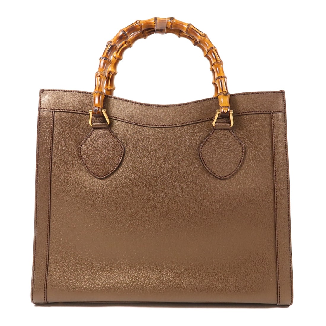 GUCCI GG Handbag Calfskin Leather Metallic Brown 002-1095: GUCCI GG Handbag Calfskin Leather Metallic Brown 002-1095 This stunning GUCCI handbag showcases a luxurious design crafted from premium calfskin leather in a rich metallic brown finish. With a height
