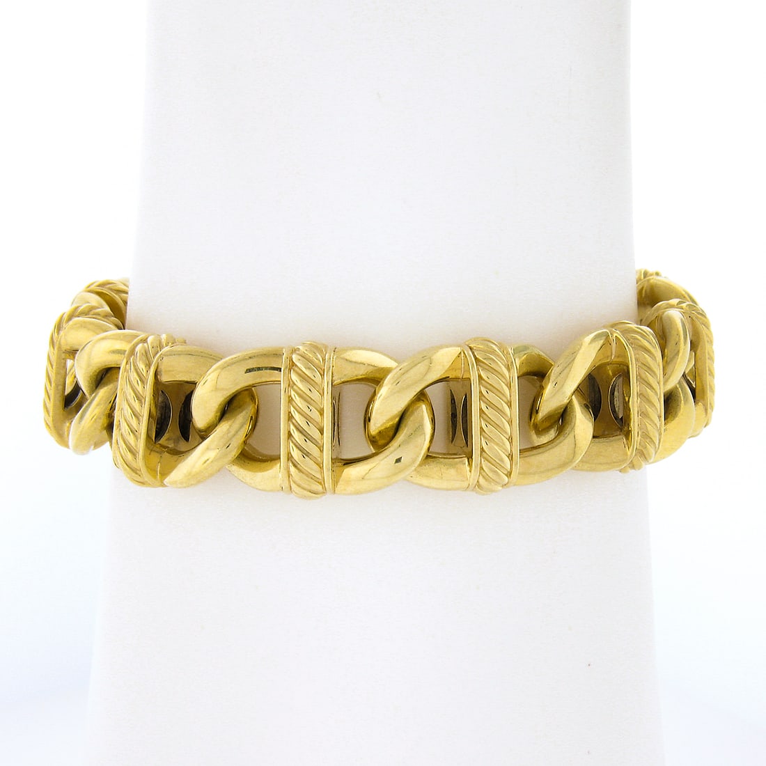 David Yurman 18K Yellow Gold 6.5 Inch Cable Link Bracelet with Twisted Wire Design: David Yurman 18K Yellow Gold 6.5 Inch Cable Link Bracelet with Twisted Wire Design This elegant David Yurman bracelet is crafted from solid 18K yellow gold, featuring a distinctive wide open cable lin