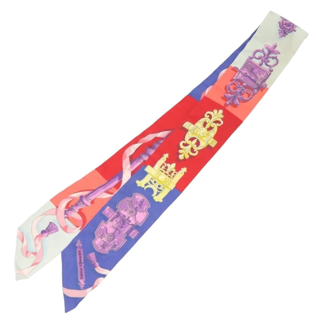 Silk Twilly Scarf by Hermes Multicolor 5cm x 85cm: Silk Twilly Scarf by Hermes Multicolor 5cm x 85cm This Hermes Twilly scarf is crafted from silk and features a multicolour design. Designed for women, it is made in France. The scarf shows signs of us