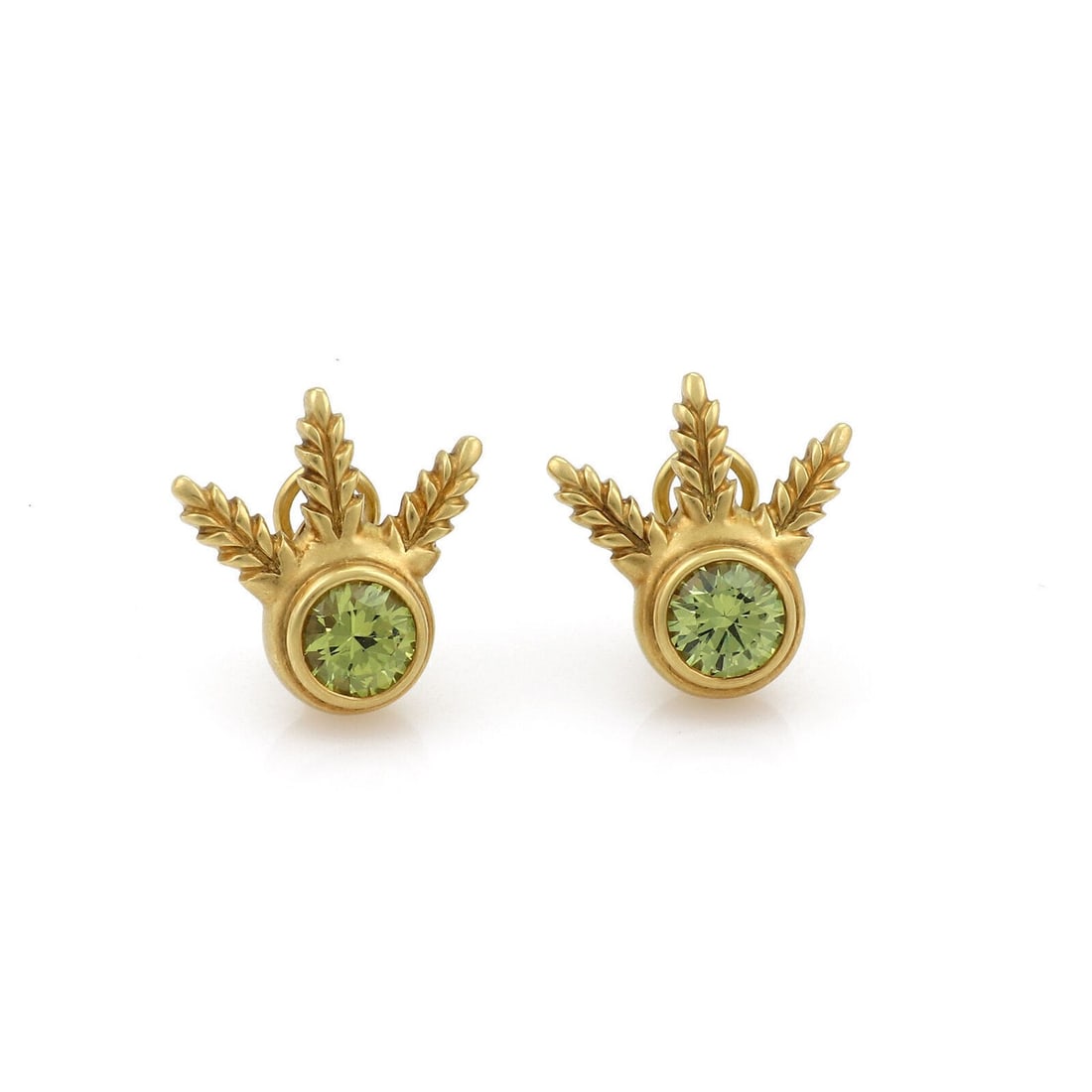 Peridot Leaf Motif Stud Earrings in 18k Yellow Gold by Elizabeth Rand: Peridot Leaf Motif Stud Earrings in 18k Yellow Gold by Elizabeth Rand These vintage Elizabeth Rand earrings feature a leaf design crafted in 18k yellow gold. Each earring is set with a vibrant peridot
