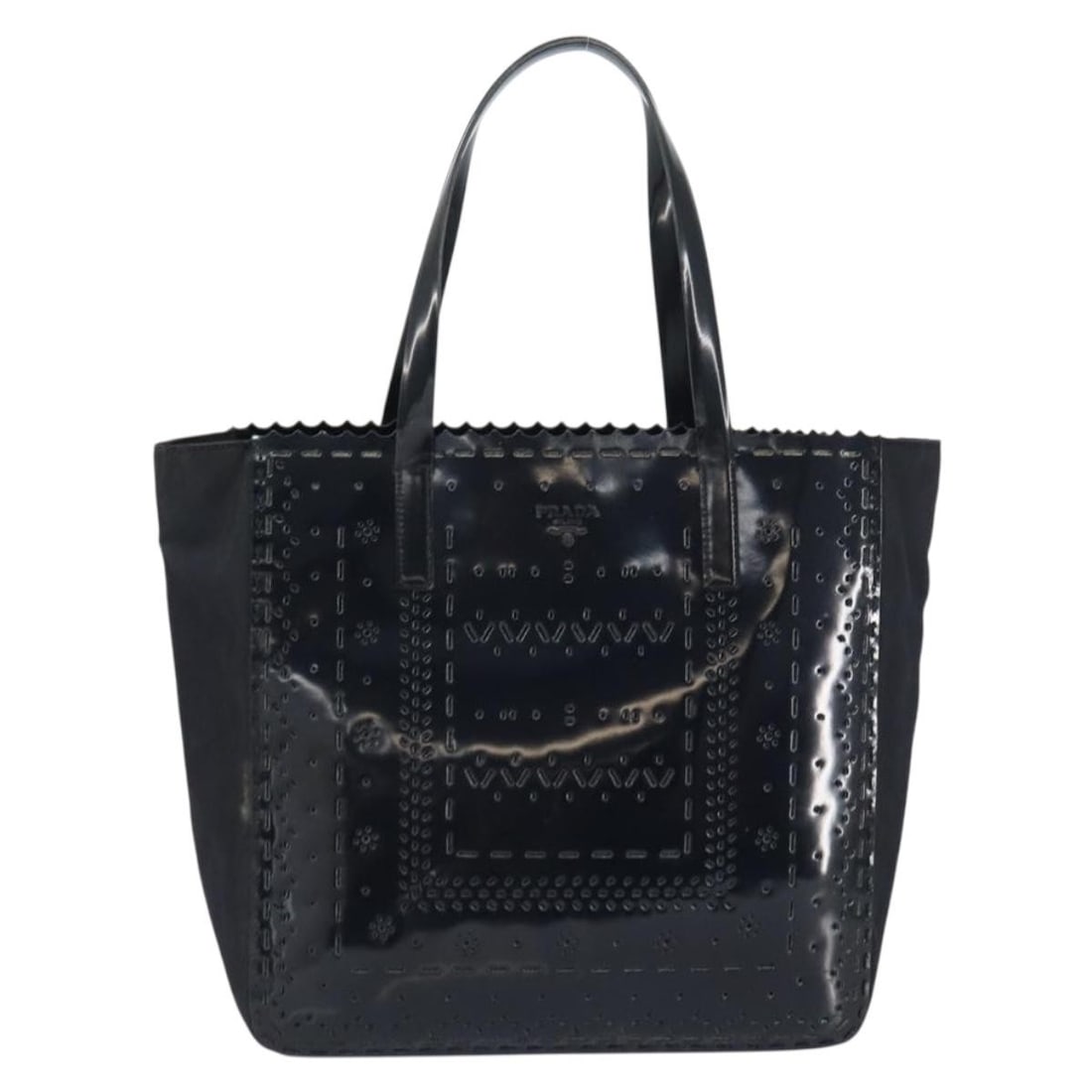 Black Patent Leather Vintage Tote by Prada Italy: Black Patent Leather Vintage Tote by Prada Italy This Prada vintage tote features a sophisticated design crafted from patent leather in classic black. Designed for women, it offers ample space with we