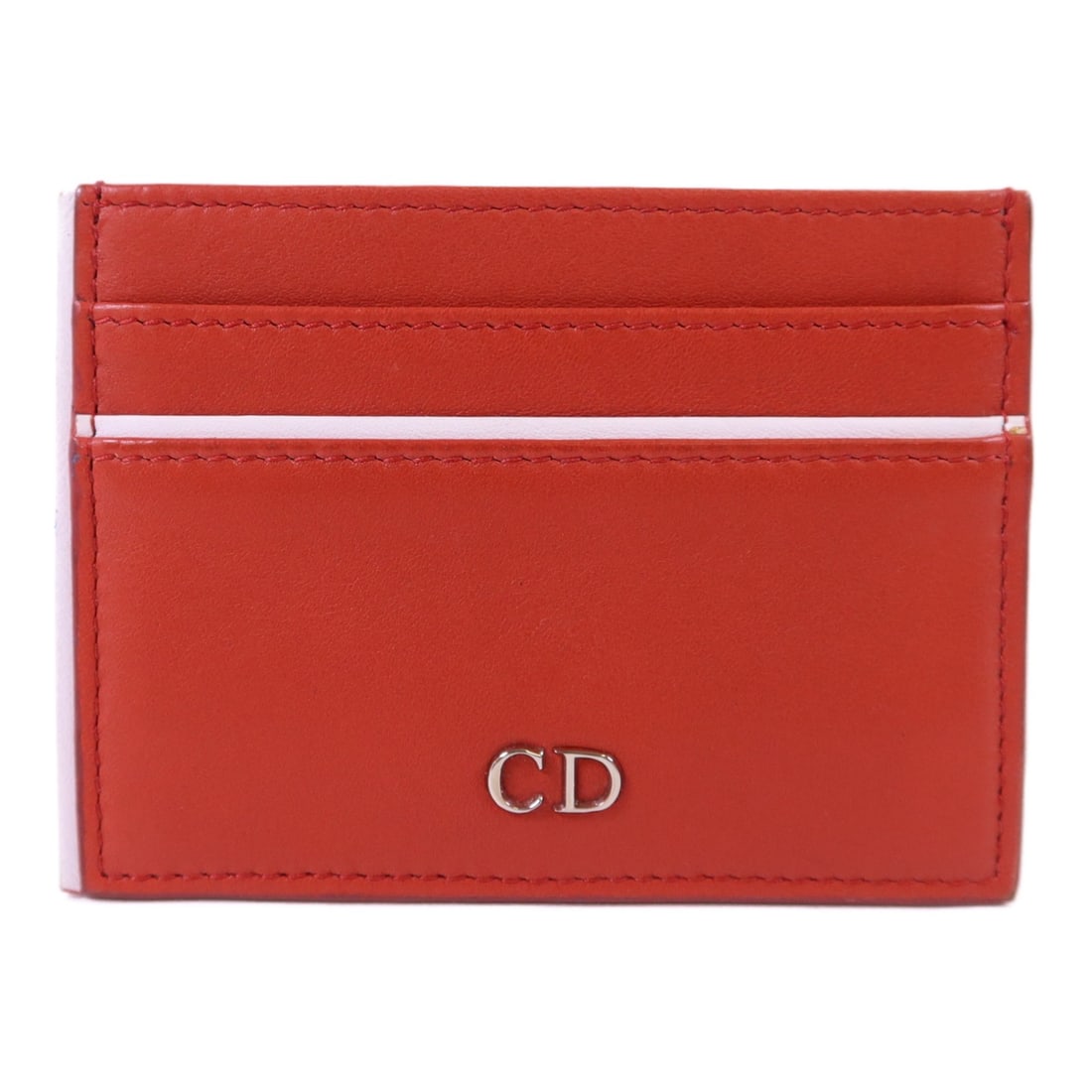Red Calfskin Christian Dior Card Case in Silver Tone Hardware: Red Calfskin Christian Dior Card Case in Silver Tone Hardware This Christian Dior card holder features a sleek design crafted from red calfskin leather. Made in France, it offers a stylish and functio