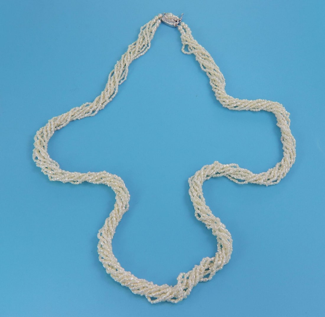 Eight Strand Keshi Pearl Necklace with Sterling Silver Clasp by Mikimoto: Eight Strand Keshi Pearl Necklace with Sterling Silver Clasp by Mikimoto This Mikimoto necklace features eight strands of lustrous keshi pearls, finished with a sterling silver clasp. The piece is sig