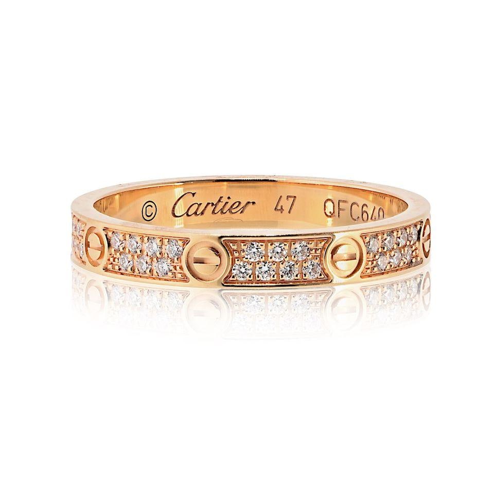 Mini Pave Diamond Love Ring in 18K Rose Gold by Cartier Size 47: Mini Pave Diamond Love Ring in 18K Rose Gold by Cartier Size 47 This Cartier Love ring is crafted from 18K rose gold and features the mini pave version of the iconic design. The band is set with brill