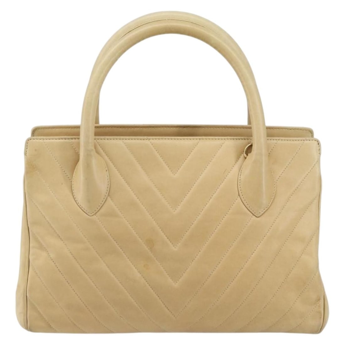 Beige Lambskin Chevron Convertible Tote by Chanel Vintage Collection: Beige Lambskin Chevron Convertible Tote by Chanel Vintage Collection This Chanel Vintage Convertible Tote features chevron-stitched lambskin leather in beige. Designed for women, the tote includes dua
