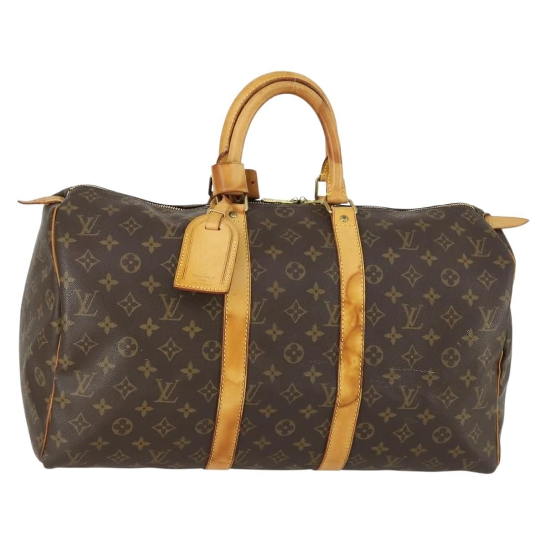 Unisex Monogram Canvas Keepall Travel Bag by Louis Vuitton: Unisex Monogram Canvas Keepall Travel Bag by Louis Vuitton This Louis Vuitton Keepall Bag features the iconic Monogram Canvas in brown and is designed for unisex use. The bag shows signs of use, inclu