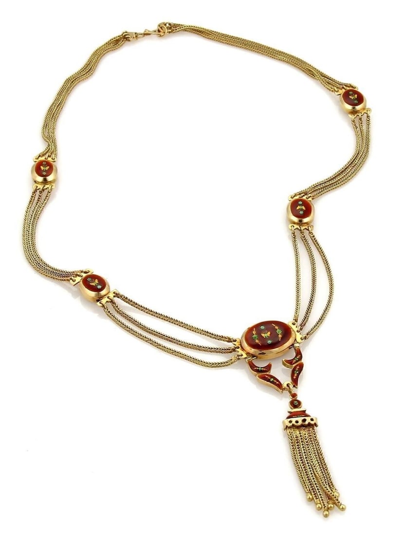 Triple Strand 18k Gold Lariat Necklace with Red Floral Enamel and Tassel: Triple Strand 18k Gold Lariat Necklace with Red Floral Enamel and Tassel This vintage lariat necklace features triple strands of 18k yellow gold adorned with antique red floral enamel detailing. The d