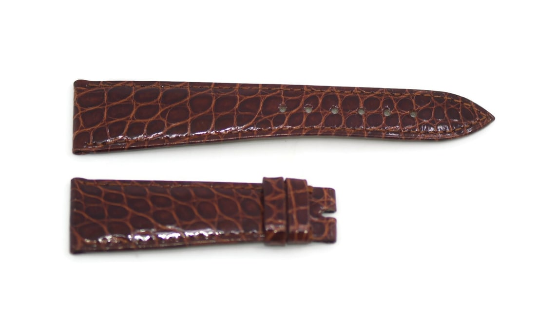 Patek Philippe Authentic Brown Leather Watch Strap 20mm: Patek Philippe Authentic Brown Leather Watch Strap 20mm Discover the elegance of this Patek Philippe brown leather strap, designed to elevate your wristwatch. Crafted from high-quality leather, this s