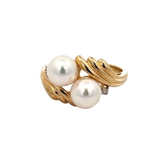 14k Yellow Gold Bypass Pearl Diamond Cocktail Ring: 14k Yellow Gold Bypass Pearl Diamond Cocktail Ring This stunning cocktail ring features a unique bypass design crafted from solid 14K yellow gold. Showcasing two exquisite round cultured pearls, each