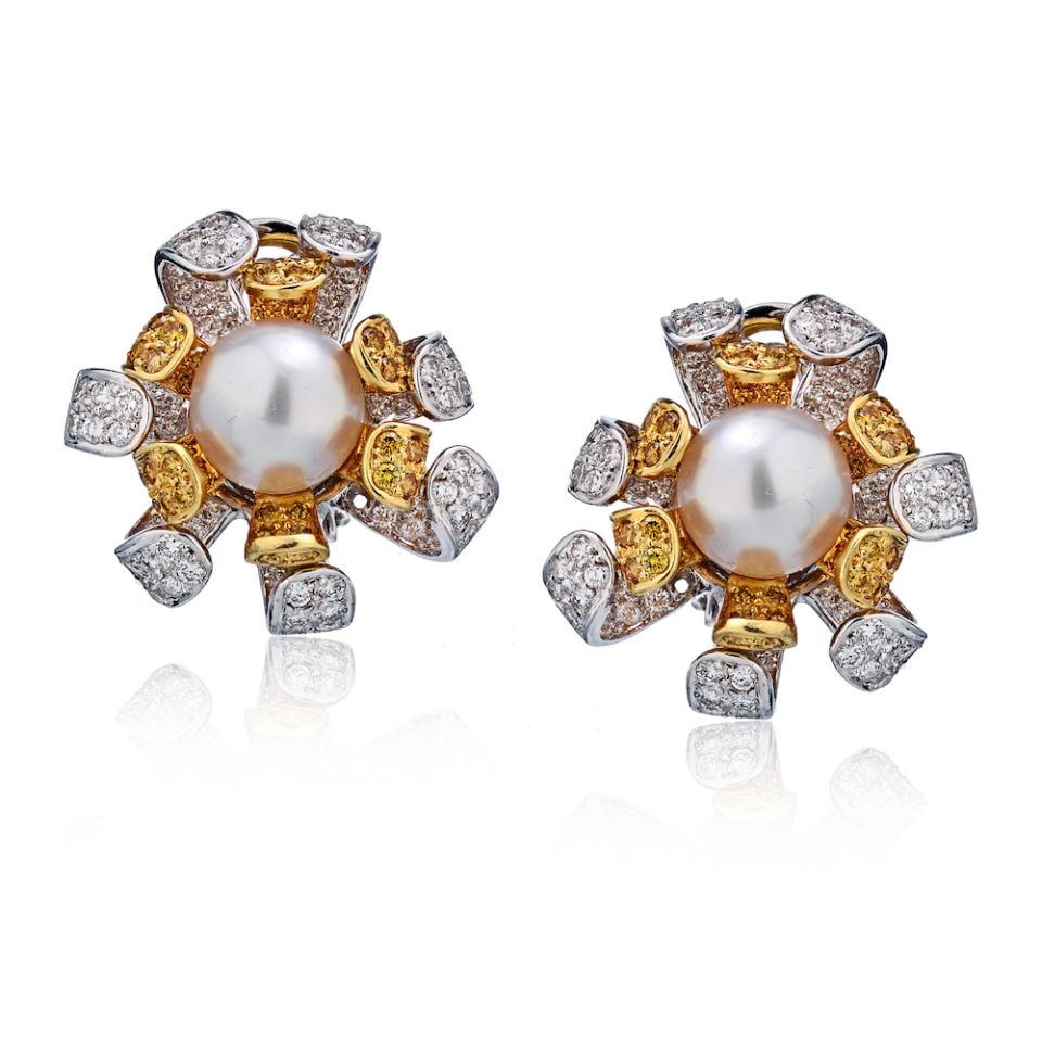 Pear Shape Fancy Yellow and White Diamond Earrings in 18K Two Tone Gold: Pear Shape Fancy Yellow and White Diamond Earrings in 18K Two Tone Gold These earrings feature an elegant pear design set with fancy yellow and white diamonds. Crafted from 18K two-tone gold, they off