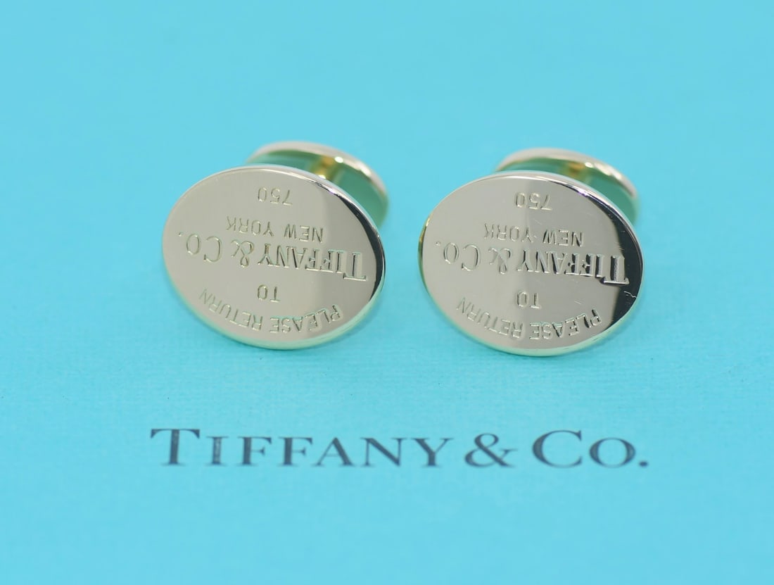 Tiffany & Co 18K Yellow Gold Cufflinks with Box and Pouch: Tiffany & Co 18K Yellow Gold Cufflinks with Box and Pouch These exquisite cufflinks by Tiffany & Co are crafted from luxurious 18K yellow gold, offering a timeless elegance suitable for any formal occ
