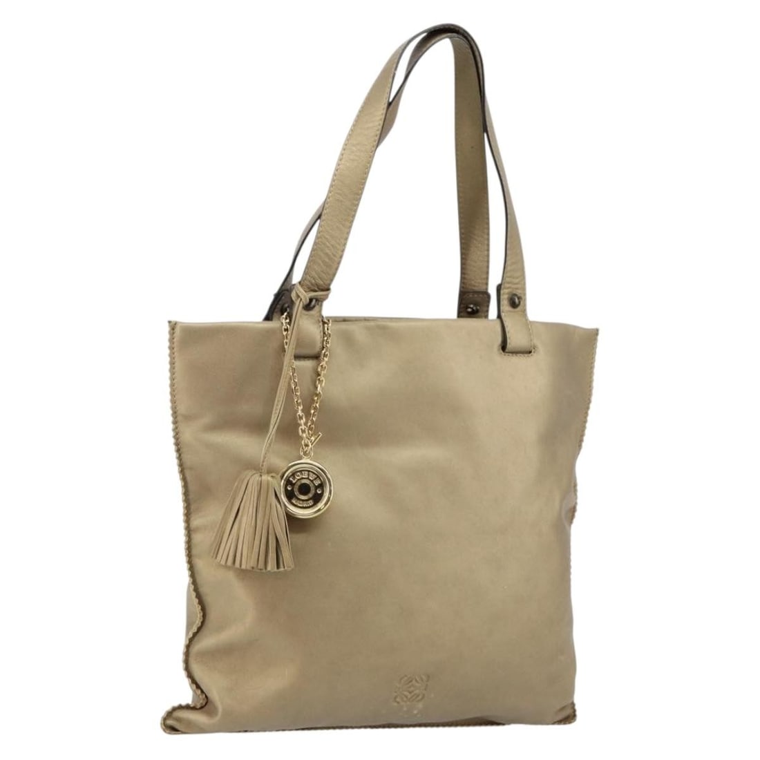 Gold Leather Tote Bag Loewe Anagram 33cm by 30cm by 30cm: Gold Leather Tote Bag Loewe Anagram 33cm by 30cm by 30cm This pre-owned Loewe Anagram Tote is crafted from gold leather and designed for women. The tote features a spacious interior with pockets and a