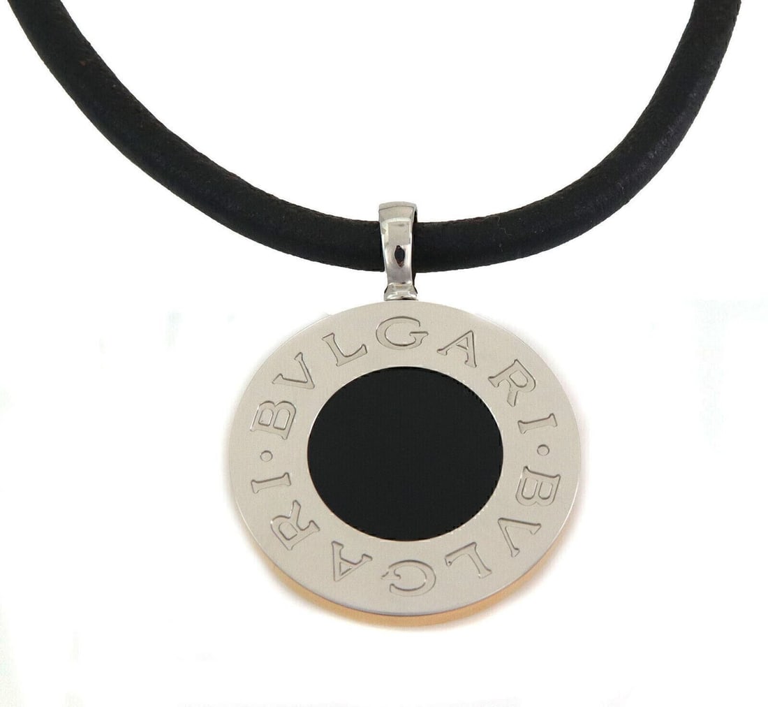 Reversible Bvlgari BVLGARI Pendant Necklace in 18k Gold Steel Onyx Mother of Pearl: Reversible Bvlgari BVLGARI Pendant Necklace in 18k Gold Steel Onyx Mother of Pearl This Bvlgari BVLGARI BVLGARI reversible pendant necklace features a striking combination of mother of pearl and black