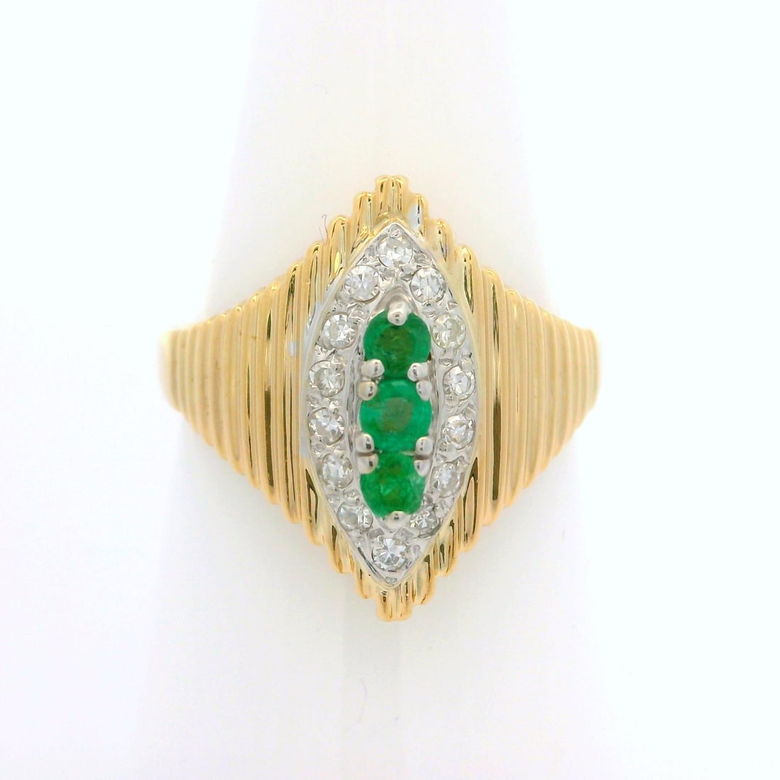 Estate 14k Yellow Gold Emerald Diamond Grooved Navette Cocktail Ring: Estate 14k Yellow Gold Emerald Diamond Grooved Navette Cocktail Ring This exquisite cocktail ring features a stunning combination of natural emeralds and diamonds, elegantly set in solid 14k yellow go