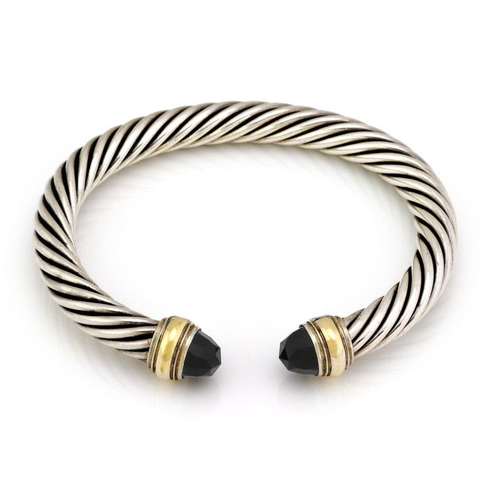 David Yurman Onyx 14k Gold Sterling Silver Cable Cuff Bracelet: David Yurman Onyx 14k Gold Sterling Silver Cable Cuff Bracelet Elevate your accessory collection with this chic authentic cable cuff bracelet by David Yurman. Crafted with a luxurious combination of s