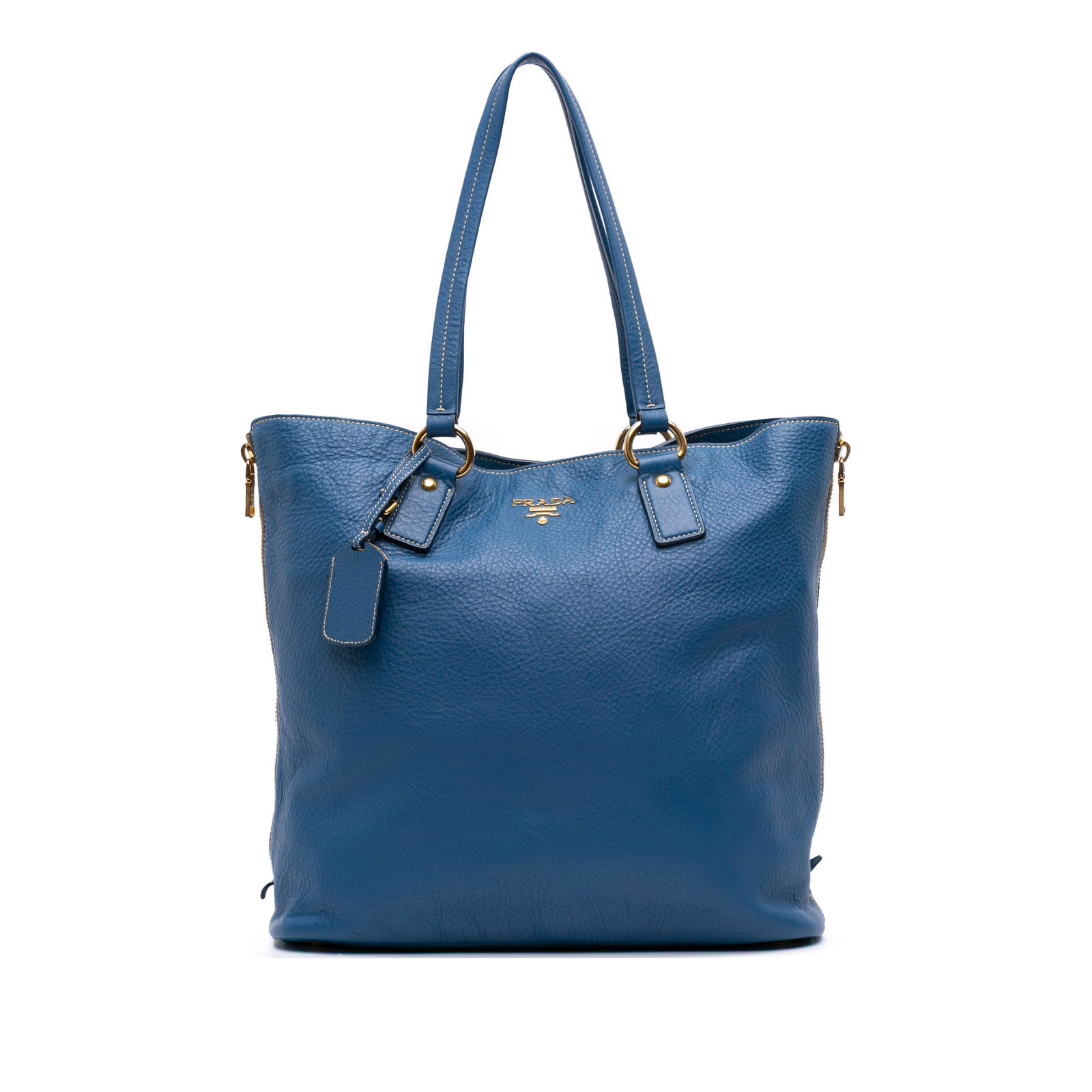 Prada Vitello Daino Blue Leather Side Zip Shopper Tote: Prada Vitello Daino Blue Leather Side Zip Shopper Tote Discover the Prada Vitello Daino Side Zip Shopper Tote, expertly crafted from luxurious leather. This stylish tote features convenient zip expans