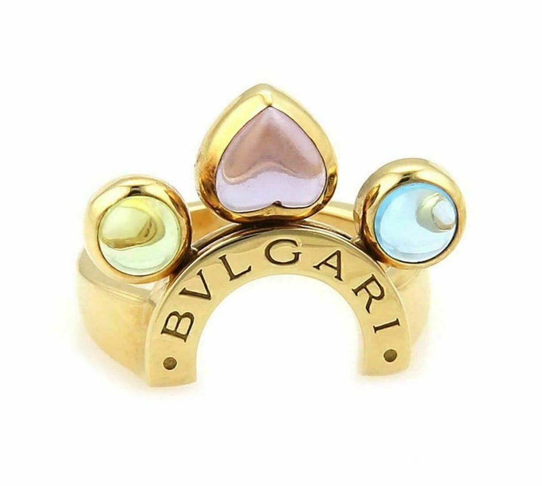 Size 6 Bvlgari Allegra Ring With Amethyst Peridot Blue Topaz 18k Yellow Gold: Size 6 Bvlgari Allegra Ring With Amethyst Peridot Blue Topaz 18k Yellow Gold This Bvlgari Allegra ring showcases amethyst, peridot, and blue topaz gemstones set in 18k yellow gold. The ring is signed