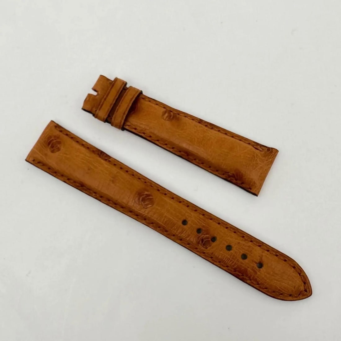 Bvlgari Honey Brown Calf Leather 19mm x 16mm Wristwatch Strap: Bvlgari Honey Brown Calf Leather 19mm x 16mm Wristwatch Strap Elevate your wristwatch with this exquisite 19mm x 16mm Honey Brown Calf strap by Bvlgari. Crafted from high-quality leather, this two-pie