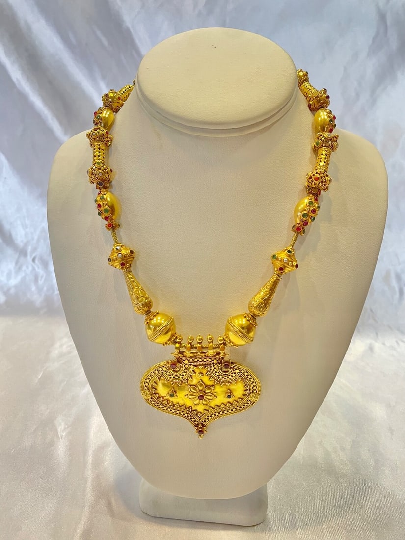 1950s 22K Gold Ruby Emerald Sapphire Diamond Necklace 102.40g: 1950s 22K Gold Ruby Emerald Sapphire Diamond Necklace 102.40g This exquisite necklace from the 1950s features a stunning combination of 22K Indian yellow gold, adorned with diamonds, rubies, emeralds,