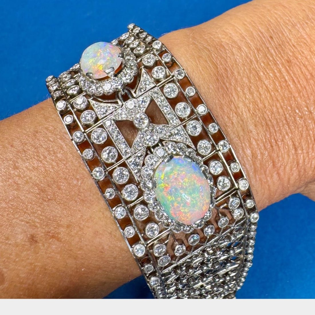 Art Deco Platinum Bracelet with Opals and 249 Diamonds: Art Deco Platinum Bracelet with Opals and 249 Diamonds This stunning Art Deco bracelet showcases an exquisite design crafted in platinum. It features a total of 189 European-cut diamonds with an