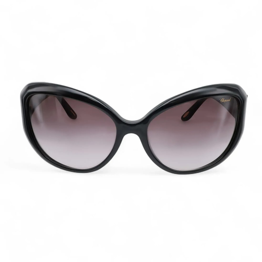 Chopard 95221-0144 Black Acetate Cat Eye Sunglasses with Gradient Smoke Lenses: Chopard 95221-0144 Black Acetate Cat Eye Sunglasses with Gradient Smoke Lenses Elevate your accessory collection with these luxurious unisex Chopard Sunglasses, model 95221-0144. Designed in a stylish