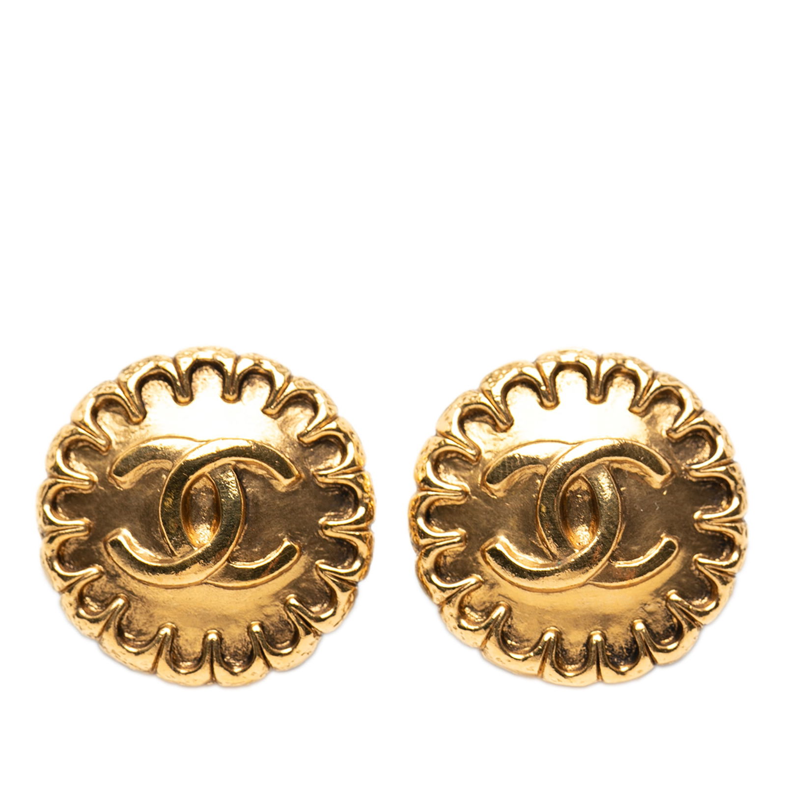 Chanel Gold Tone Round Clip On Earrings CC Logo: Chanel Gold Tone Round Clip On Earrings CC Logo These Chanel CC gold-tone round clip-on earrings feature a metal body with the iconic CC logo. Made in France, they offer a classic costume jewelry