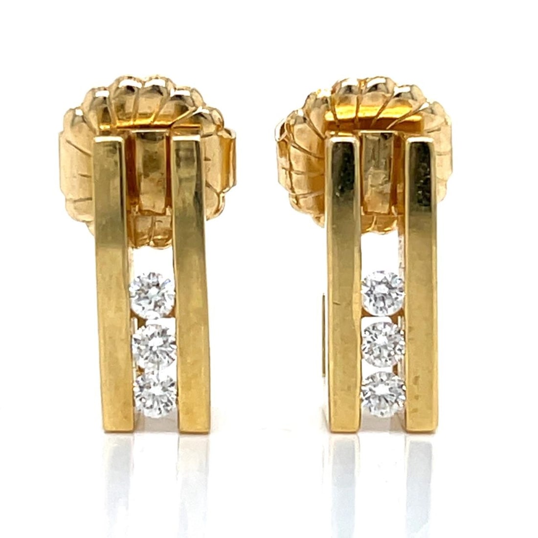 Diamond Earrings in 14K Yellow Gold with Six Stones 0.75 Inch: Diamond Earrings in 14K Yellow Gold with Six Stones 0.75 Inch These earrings are crafted from 14K yellow gold and are set with six diamonds totaling approximately 0.40 carats. The diamonds feature G-H