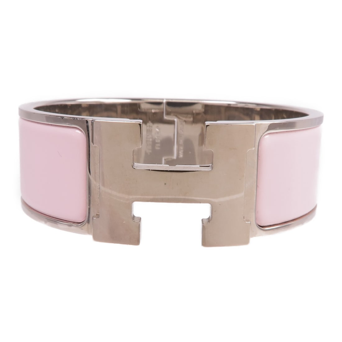 Pink Enamel Clic Clac H Bracelet by Hermes: Pink Enamel Clic Clac H Bracelet by Hermes This Hermes Clic Clac H bracelet features a pink enamel exterior with metallic accents. Crafted in France, it is designed without any gemstones and offers a