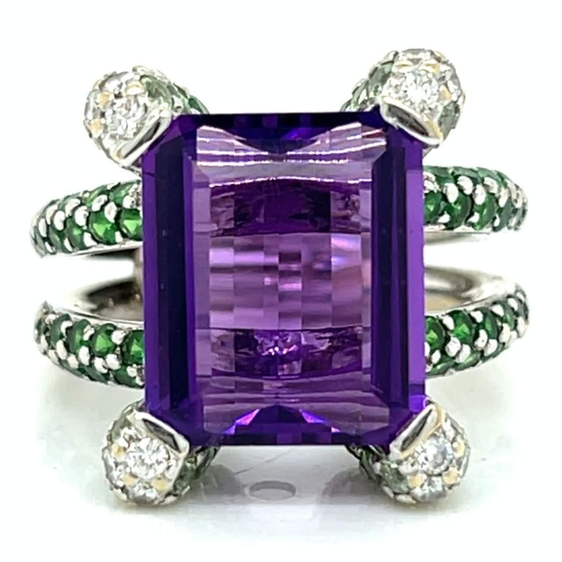 18K White Gold Ring with Amethyst Garnet and Diamond Gems: 18K White Gold Ring with Amethyst Garnet and Diamond Gems This stunning 18K white gold ring features a vibrant combination of gemstones, including an approximate 6.00 Ct. amethyst, 100 garnets totalin