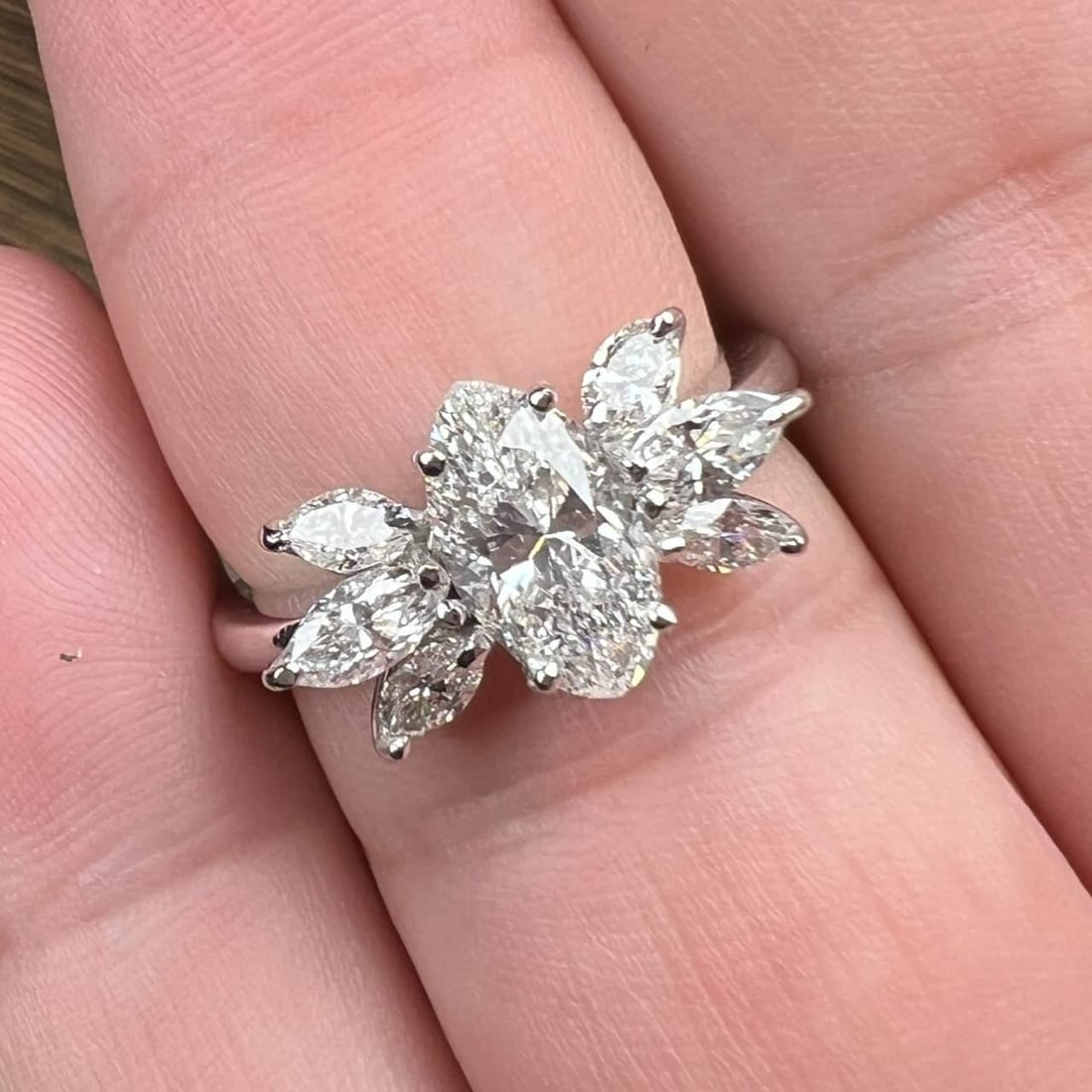 Exquisite 18K White Gold 2.10 Ct Diamond Ring with Marquise Center: Exquisite 18K White Gold 2.10 Ct Diamond Ring with Marquise Center This exquisite 18K White Gold ring features a stunning 2.10 Ct. total diamond weight. The centerpiece is a captivating approximately