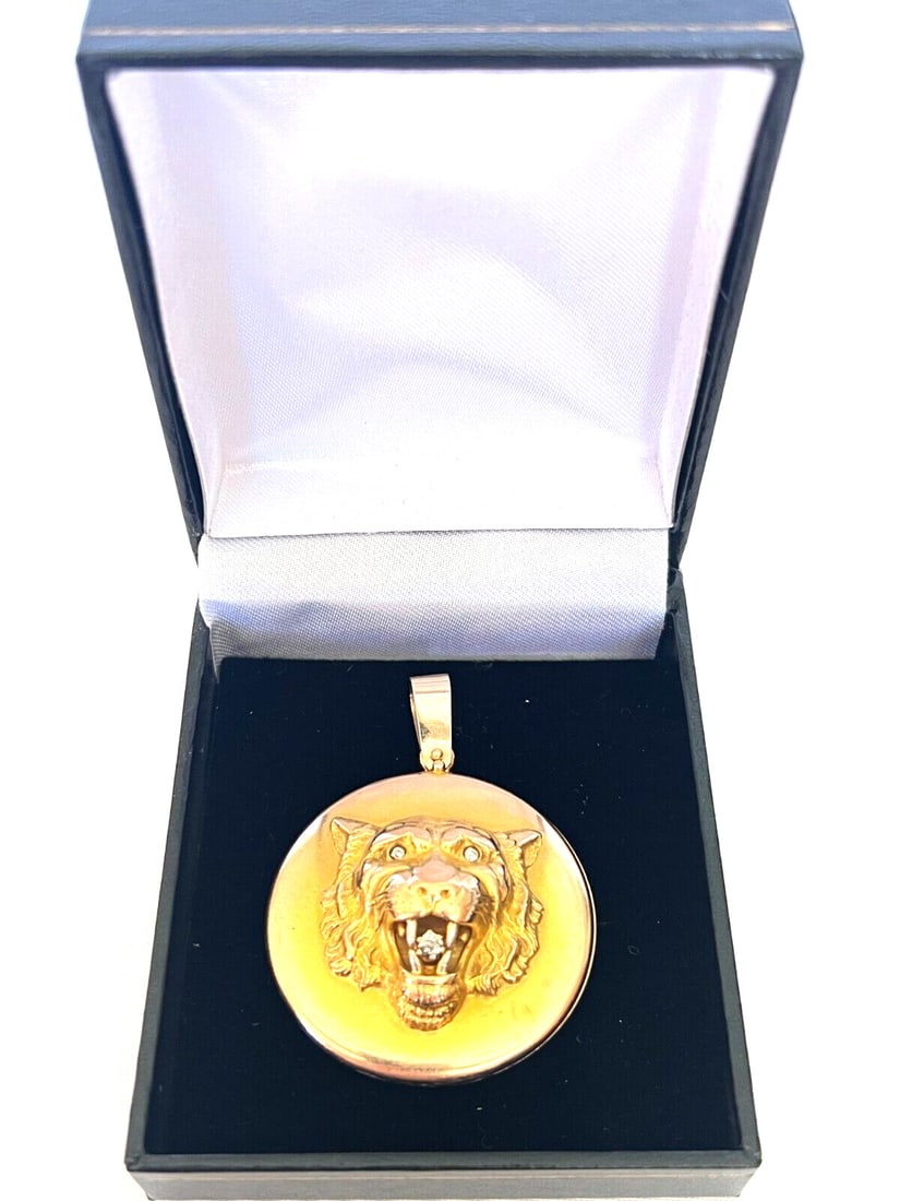 19th Century Victorian 18K Gold Diamond Lion Locket Necklace: 19th Century Victorian 18K Gold Diamond Lion Locket Necklace Discover this exquisite 19th-century antique locket necklace crafted from 18K yellow gold. This Victorian-style piece features a detailed l