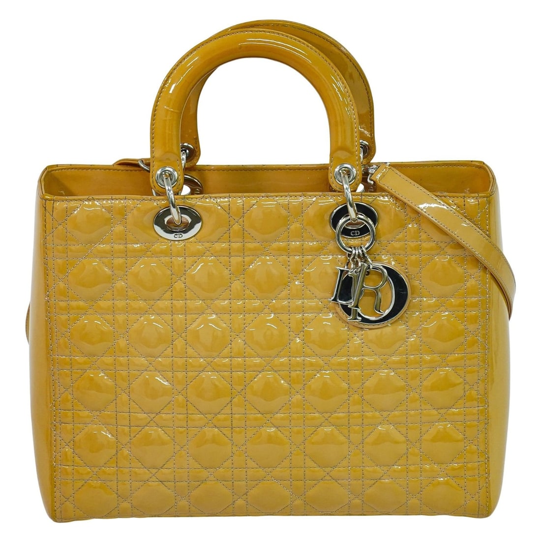 Beige Patent Leather Vintage Lady Dior Handbag with Cannage Quilting: Beige Patent Leather Vintage Lady Dior Handbag with Cannage Quilting This is a vintage Lady Dior bag featuring the signature Cannage quilt design in patent leather. The bag, originally pink, has faded