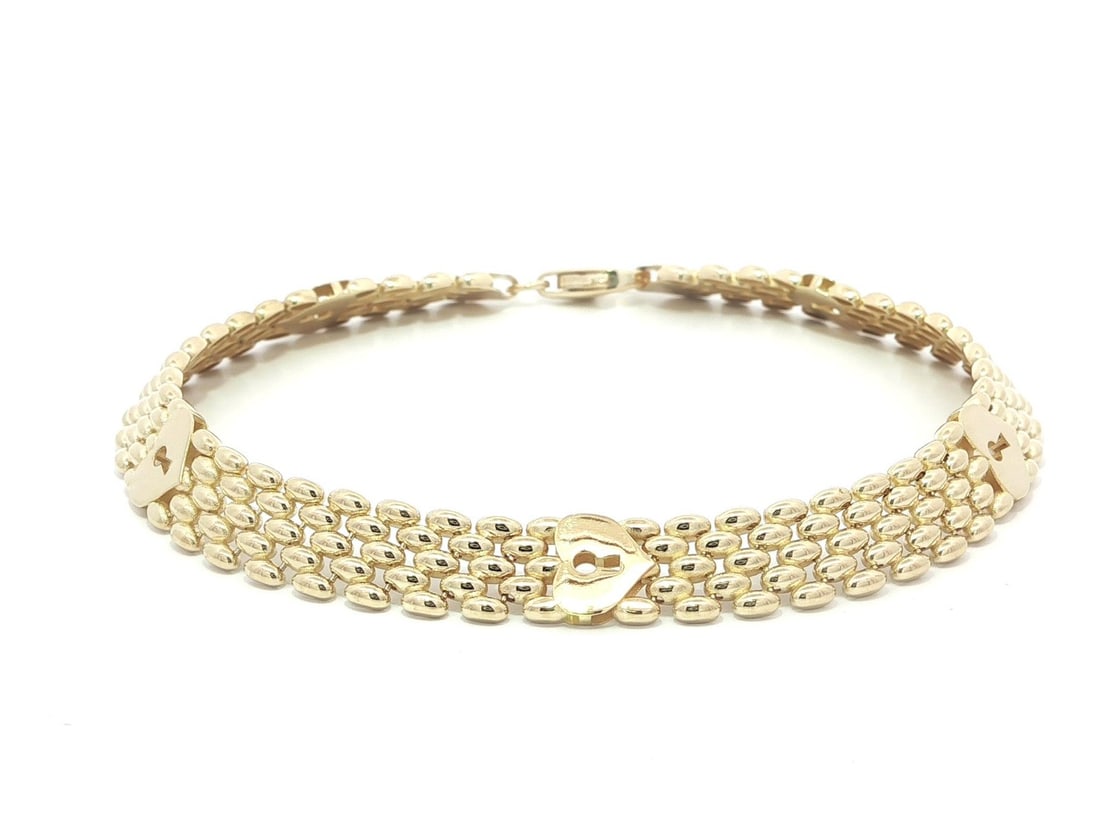 Panther Link Bracelet Solid 14k Yellow Gold with Heart Padlock Key Stations: Panther Link Bracelet Solid 14k Yellow Gold with Heart Padlock Key Stations This un-used panther link bracelet features solid 14k yellow gold construction and is designed with heart padlock key statio