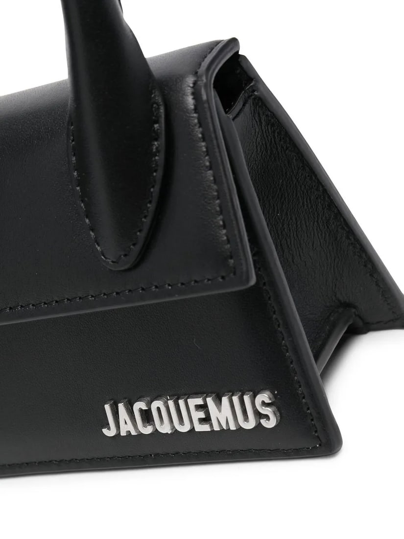 Jacquemus Le Chiquito Mini Black Leather Bag for Men: Jacquemus Le Chiquito Mini Black Leather Bag for Men The Jacquemus Le Chiquito Mini is a compact leather bag in black, designed for men. Crafted in Italy, it features a sleek silhouette and is present