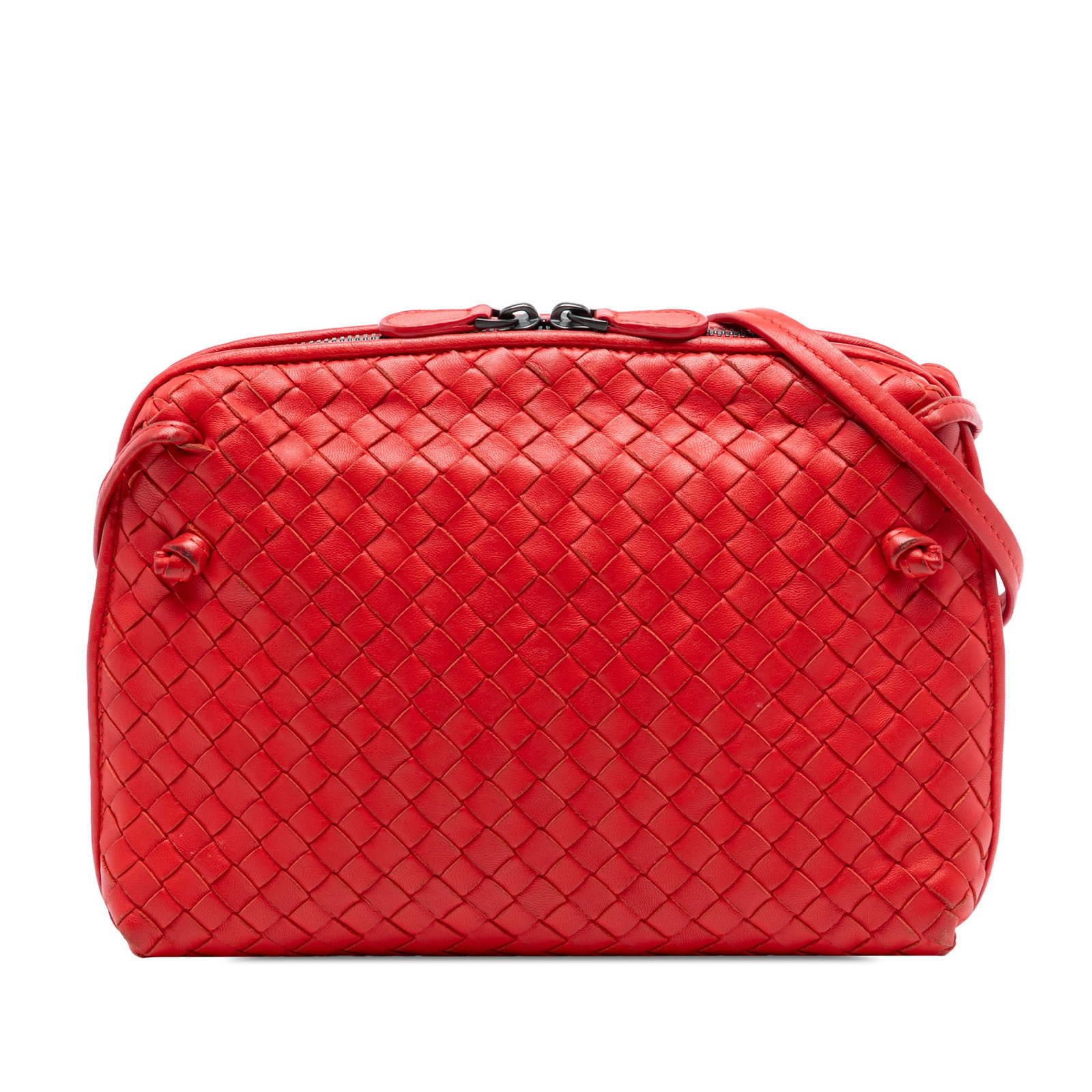 Red Nappa Leather Nodini Woven Crossbody Bag by Bottega Veneta: Red Nappa Leather Nodini Woven Crossbody Bag by Bottega Veneta This Bottega Veneta Nodini crossbody bag showcases the brand's signature woven nappa leather design in red, complemented by a flat leathe