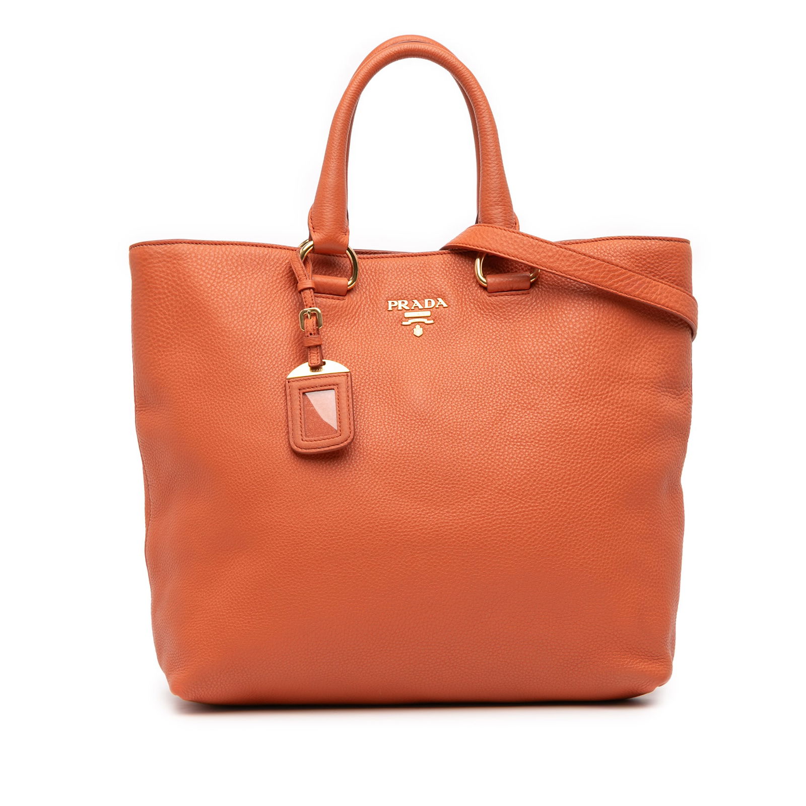Prada Vitello Daino Convertible Tote in Orange Leather: Prada Vitello Daino Convertible Tote in Orange Leather This Prada Vitello Daino Open Convertible Tote showcases a luxurious vitello daino leather body in a vibrant orange hue. It features rolled leath