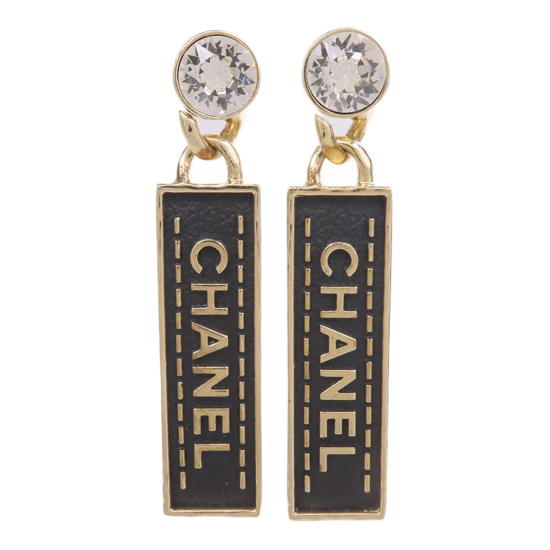 Gold Tone Metal Pierced Earrings with Black CC Logo by CHANEL: Gold Tone Metal Pierced Earrings with Black CC Logo by CHANEL These CHANEL CC pierced earrings feature a stylish gold-tone metal design with black detailing. Made in France, they do not feature any st