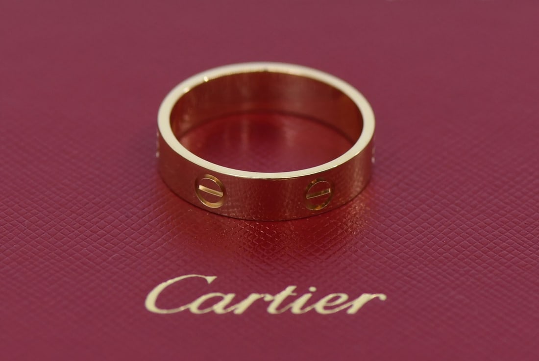 18k Yellow Gold Cartier Love Band Size 65 with Box and Certificate: 18k Yellow Gold Cartier Love Band Size 65 with Box and Certificate This Cartier Love ring is crafted from 18K yellow gold and features the iconic Love motif. The ring is size 65 (US 11.5) and does not