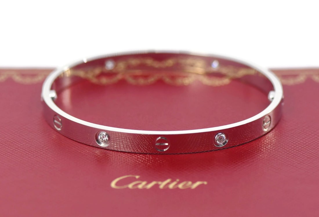 Cartier Love Bracelet 4 Diamonds in 18K White Gold Size 19 Authentic: Cartier Love Bracelet 4 Diamonds in 18K White Gold Size 19 Authentic This exquisite Cartier Love Bracelet features four sparkling diamonds set in luxurious 18K white gold. The bangle style is a timele