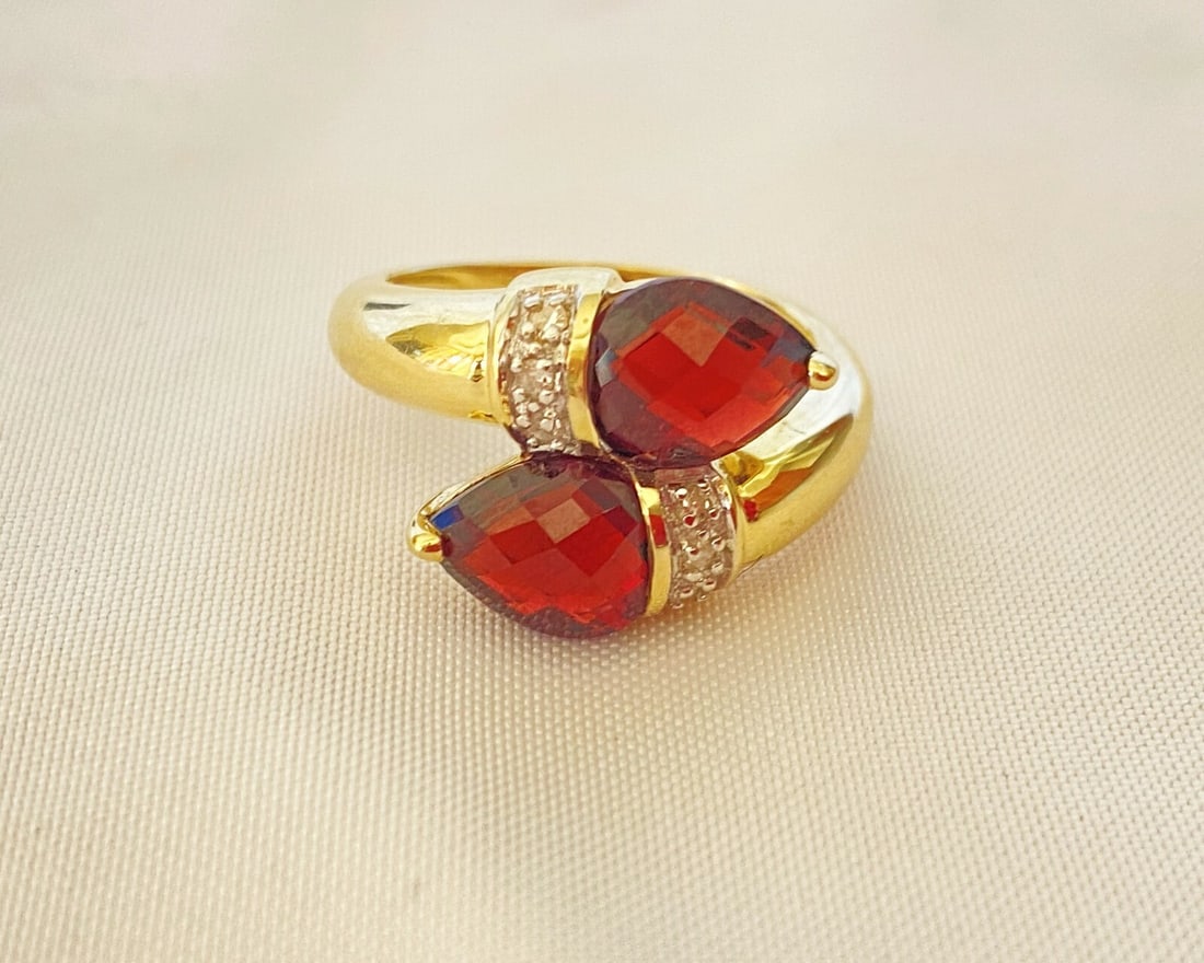 French 14K Yellow Gold Diamond Garnet Ring Size 7: French 14K Yellow Gold Diamond Garnet Ring Size 7 This exquisite French ring features a stunning pear-shaped garnet set in 14K yellow gold, complemented by sparkling diamonds. It is a size 7 and weigh