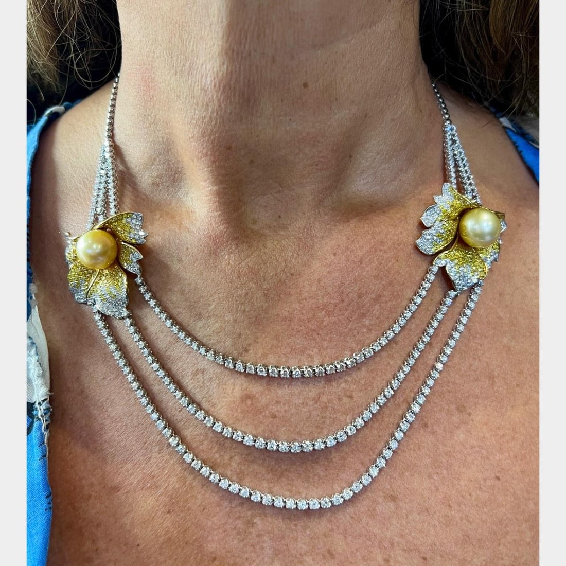 18K White Gold Necklace with South Sea Pearls and Yellow Diamond Accents: 18K White Gold Necklace with South Sea Pearls and Yellow Diamond Accents This necklace is crafted from 18K white gold and features two South Sea pearls measuring 15.5 x 13.2mm. It is adorned with 4.17