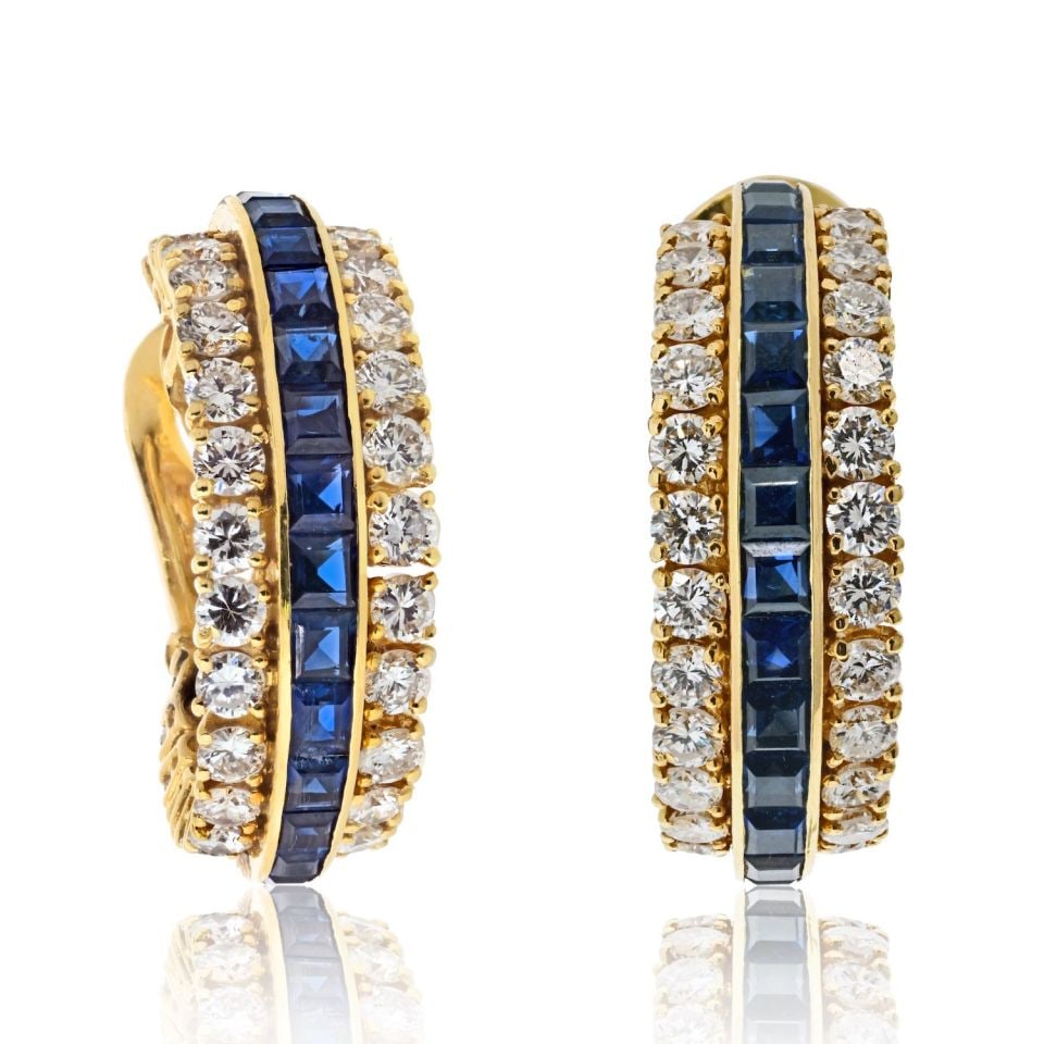 Van Cleef & Arpels 18K Gold Sapphire Diamond Hoop Earrings: Van Cleef & Arpels 18K Gold Sapphire Diamond Hoop Earrings Experience the elegance of Van Cleef & Arpels with these exquisite 18K Yellow Gold Hoop Earrings, adorned with vibrant blue sapphires and spa