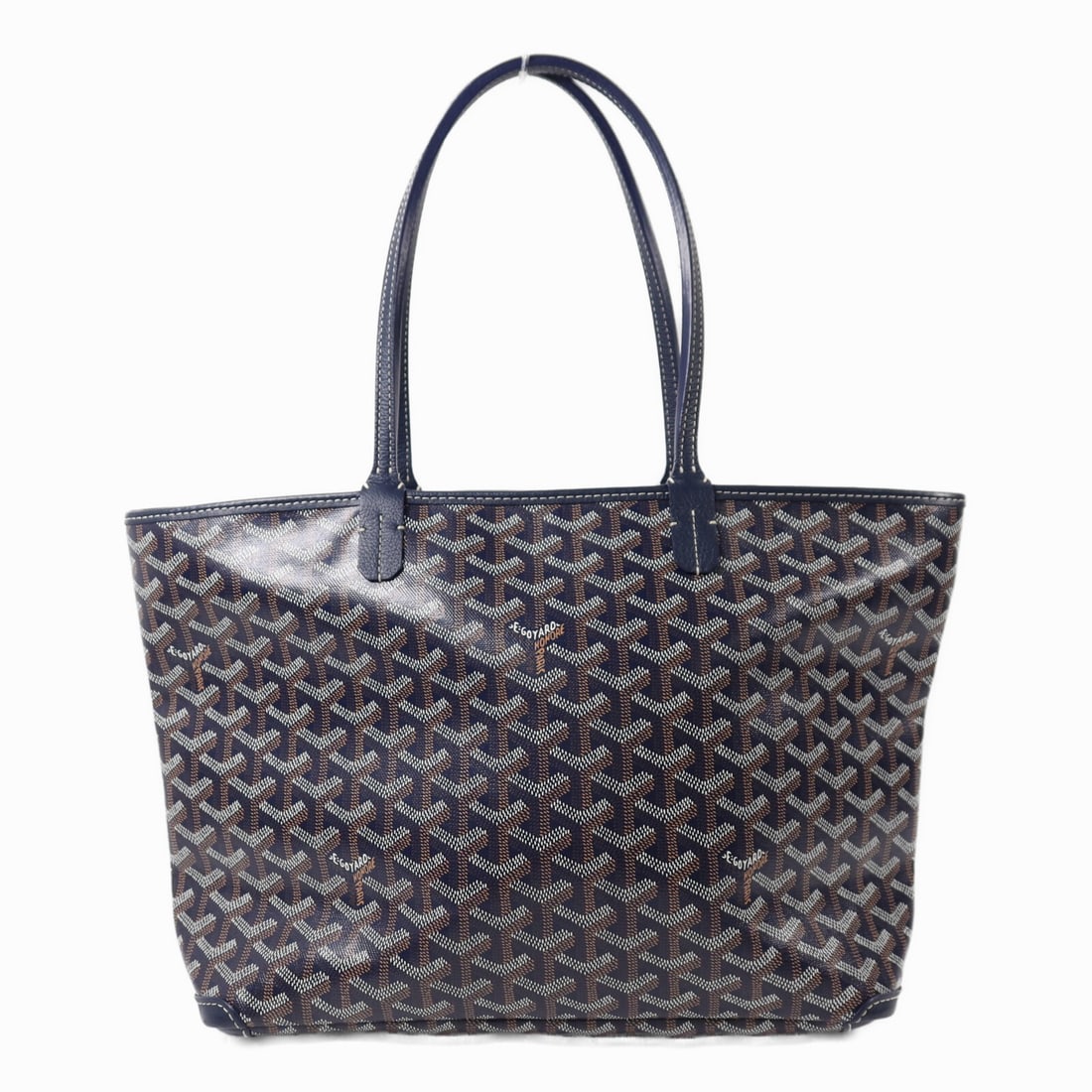 Goyard Artois PM Tote Blue Coated Canvas Silver Hardware: Goyard Artois PM Tote Blue Coated Canvas Silver Hardware This Goyard Artois PM tote bag is crafted from durable PVC coated canvas in a striking navy blue color. Made in France, the tote features a reg