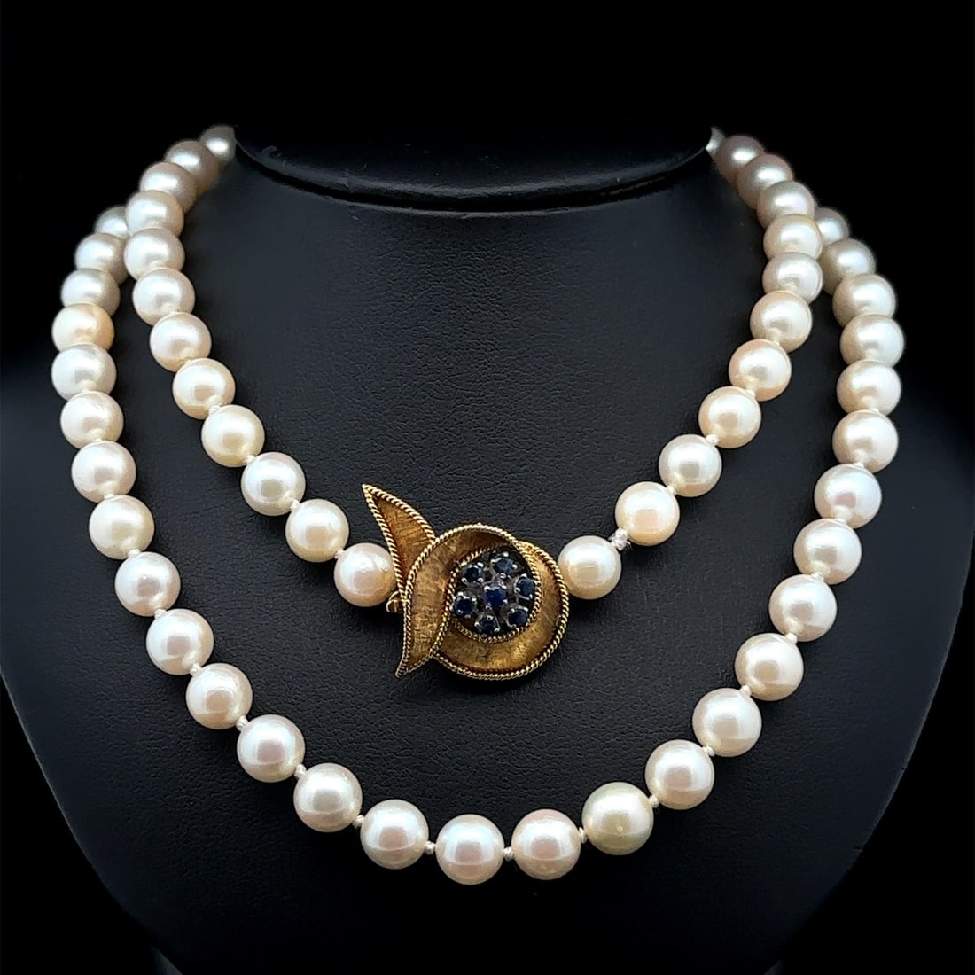 Natural Pearl Necklace with 14k Gold Sapphire Twisted Clasp 26": Natural Pearl Necklace with 14k Gold Sapphire Twisted Clasp 26" Elevate your style with this stunning Pearl Strand Necklace featuring a luxurious 14k Yellow Gold clasp adorned with sparkling sapphires